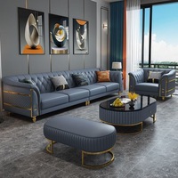 Ensemble de canapés capitonnés en cuir véritable avec ottoman, fauteuil et pieds en métal doré, matelassé, luxe bleu-orange pour salon et villa