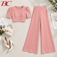 Ensemble élégant deux pièces pour femme : chemise ample unie à col rond et manches bouffantes trois-quarts, et pantalon taille haute à jambes larges – Tenue de bureau