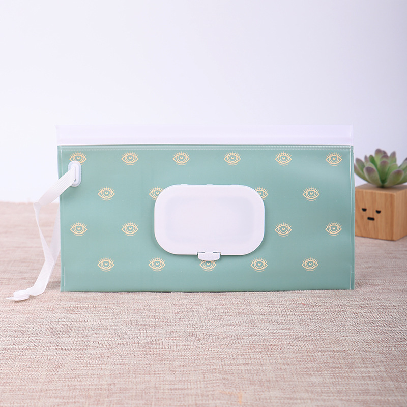 Yeux sur le fond vert [sac de lingettes humides]