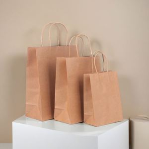KM 28*15*28cm Handmade <b>Biodegradable</b> Natural Shopping Brown Paper <b>Packaging</b> Food Grade Gift Kraft Paper Bag With Handle - Product Image 1