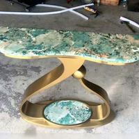 Console d'entrée en métal de luxe léger avec plateau en marbre et structure en acier inoxydable, design silencieux pour usage en restaurant