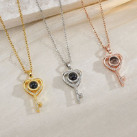 Collier de projection transfrontalier « Je t'aime » en 100 langues, pendentif cœur creux en forme de clé, élégant et tendance pour femme, en cuivre bambou