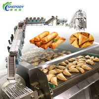 Chaîne de production de friteuses continues Shepody SUS 304 pour la fabrication de rouleaux de printemps, galettes de crevettes et empanadas frites à petite échelle