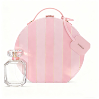 Boîte cadeau de parfum en cuir unique pour femme Design de poignée d'emballage avec insertion Boîte ronde de vitrine de parfum en cuir de luxe personnalisée