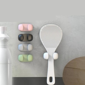 Un outil de fixation en silicone pour la spatule à riz dans la cuve de cuisson murale de la cuisine - Product Image 1