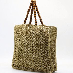 Bolso de playa de malla de ganchillo hueco para mujer, novedad de verano 2025, con asa de cuentas de madera - Product Image 1
