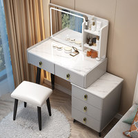 Table de toilette moderne minimaliste haut de gamme avec miroir éclairé et armoire de rangement.