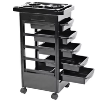 Chariot de coiffure moderne en plastique noir à 5 niveaux et 4 roues, avec vérin pneumatique, support pour bol de teinture et fonctions d'organisation, pour usage en salon
