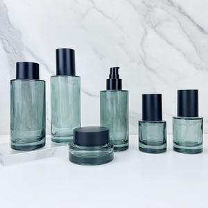 ขวดแก้วสีเขียวเข้มทรงแบนไหล่ลาด ขนาด 100/150 มล. ก้นหนา พิมพ์ลายสกรีน พร้อมฝาเกลียว สำหรับใส่โทนเนอร์ ลดราคาพิเศษ - Product Image 1