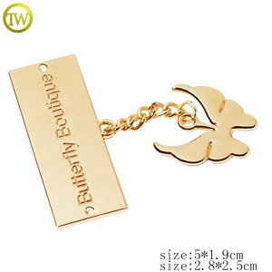 Etichette Metalliche Personalizzate per <span class=keywords><strong>Abbigliamento</strong></span>, <span class=keywords><strong>Accessori</strong></span> per Indumenti in Metallo Dorato con Logo a Farfalla - Product Image 2