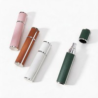 Vente en gros d'atomiseurs de parfum en verre enveloppés de cuir de luxe, cylindriques, avec bouchon rotatif, 5 ml, 10 ml, mini flacon de voyage rechargeable, logo personnalisé