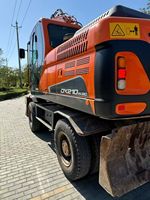 Excavatrice sur pneus Doosan DX210W d'occasion, 20 tonnes, d'origine coréenne, pour travaux routiers