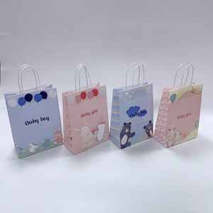 Sacs cadeaux en papier kraft blanc recyclable avec poignées, emballage pour faveur de baby shower, prêt à être expédié en stock pour une utilisation lors de célébrations de naissance - Product Image 2