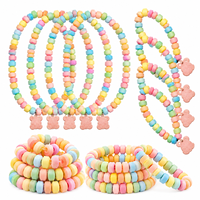 Vente en gros OEM de bonbons personnalisés multicolores en forme de collier et de bracelet, bonbons durs compressés saveur fruitée, étiquette personnalisée, en vrac pour fêtes