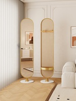 Miroir sur pied moderne rotatif pleine longueur avec cadre métallique et étagère pour salon