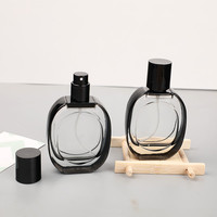 Botella de Perfume de Vidrio Ovalada de 30 ml con Borde Negro y Tapas Negras, Personalizable con la Etiqueta de su Marca