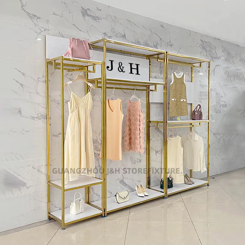 Espositore per negozio di abbigliamento donna di moda design con logo personalizzato in metallo dorato con mensole appese per vestiti