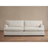 Canapé modulaire moderne en tissu performant résistant aux taches, silhouette élégante et larges accoudoirs, meubles de luxe