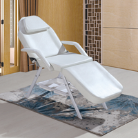 Chaise de massage de beauté luxueuse avec cadre en acier inoxydable noir et blanc, pieds réglables, pliable, lit de tatouage, lit de barbier, thérapie faciale, hôtel
