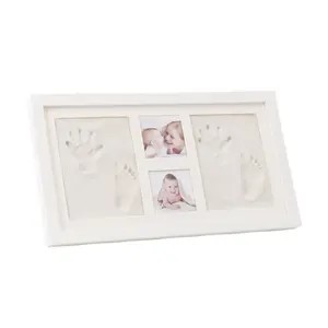 A solid wood photo frame gift box with imprints made of clay, used to reproduce the handprints and footprints of a newborn baby.