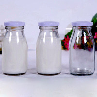 Bouteilles en verre transparent en gros, haute performance, spécifications de taille pour lait, yaourt et boissons, canettes à fruits