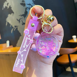 Exquisitos regalos pequeños mochila colgante aceite botella flotante llavero lindo líquido forma de reloj despertador llavero con banda - Product Image 3