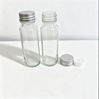 Botella de jugo de vidrio transparente vacía de 50ml con rosca continua Anillo de tapón de rosca de agua Botellas de disparos de molinillo de vidrio redondo largo y delgado