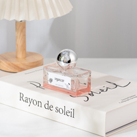 Flacon de parfum rectangulaire de luxe en verre rose transparent, longue durée, avec bouchon en forme de boule