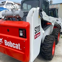 Chargeuse compacte Bobcat S220 d'occasion, capacité nominale 1035 kg, avec attaches rapides Bob-Tach pour la construction, l'agriculture et l'aménagement paysager
