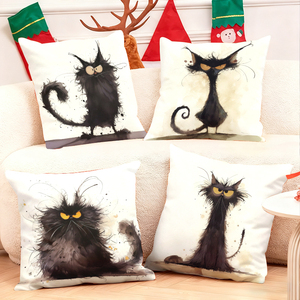 Set empat bantal hiasan berbentuk kucing hitam yang unik dengan dekorasi liburan yang meriah di latar belakangnya. - Product Image 1