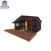 Maison modulaire préfabriquée complète en conteneur, aspect grain de bois foncé, structure en acier pour résidence