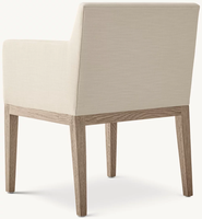 Fauteuil de salle à manger moderne et élégant avec dossier incurvé lisse et accoudoirs en tissu, coussin d'assise élastique.