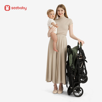 2025 dernière poussette pliante en polyester à cadre en acier inoxydable vert pour deux enfants avec chariot de rassemblement pratique