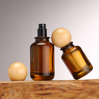 Vente en gros Flacons de parfum en verre ambré de luxe ronds de 30ml 50ml 100ml Flacon diffuseur en verre avec boule à bouchon rond