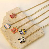 Collier chaîne clavicule en acier inoxydable avec pendentif patte de chat mignon et design, motif empreinte animale, finition goutte d'huile, cadeau unisexe