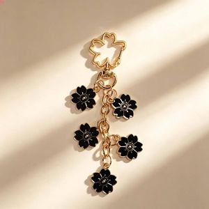 QQ New Enamel Flower <b>Keychain</b> Pendant Cherry Blossom <b>Keychain</b> High-end Design Key Ring Wholesale in Stock - Product Image 2