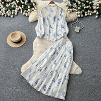 Ensemble élégant pour femme, chemisier à manches longues à col noué fleuri pour le début de l'automne, jupe midi à volants, tenue de bureau élégante
