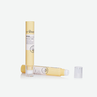 Tube souple en PE jaune clair avec applicateur à bille en acier inoxydable et capuchon extérieur transparent pour crème contour des yeux anti-rides