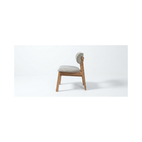 Chaise de salle à manger haut de gamme avec coussin moelleux, design ergonomique, structure robuste, mobilier moderne pour salle à manger intérieure
