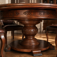 Table à manger ronde extensible de style américain avec marqueterie en bois incrusté, bordure sculptée et base tournée