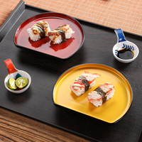 Assiette à sushi en plastique de forme irrégulière de style japonais et coréen créatif avec support pour la présentation en hôtel et restaurant