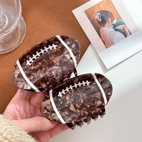 Pince à cheveux en acétate épissé pour le rugby et le football Pince à cheveux pour queue de cheval personnalisée à la mode pour femmes Pinces à cheveux en forme de rugby