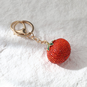 Meilleure vente : Boutons de manchette de luxe léger entièrement ornés de strass, motif kaki, pour filles, avec pendentif porte-clés de sac de voiture en forme de fruit, sensation haut de gamme, style sportif - Product Image 4