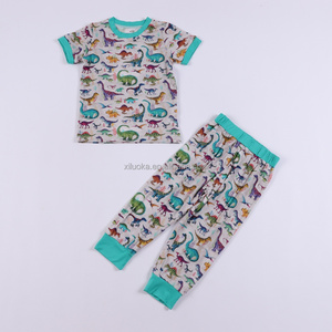 <span class=keywords><strong>Pigiama</strong></span> per Neonati in Viscosa Sostenibile con Stampa Dinosauro, Manica Corta, Traspirante, Certificato CPC e CPSIA, Produzione OEM Personalizzata all'Ingrosso - Product Image 1