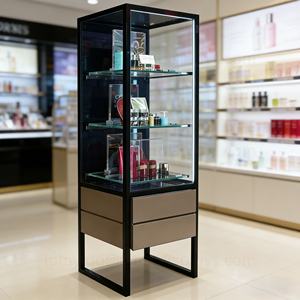 Vitrine de présentation de parfums avec tiroirs de rangement, en métal et en verre, sur pied, pour produits de soin de la peau de luxe en magasin de détail - Product Image 1