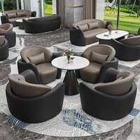 Ensemble de canapés commerciaux haut de gamme en cuir noir et marron avec table basse en marbre, mobilier pour hall d'hôtel