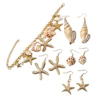 Collier, bracelet et boucles d'oreilles unisexes plaqués or, style bohème chic, avec breloques en forme de coquillage, étoile de mer et conque, pour la vente en gros