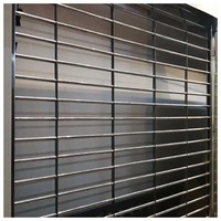 Volet roulant moderne en acier inoxydable à mailles grillagées, surface finie, pour centre commercial, conception antivol, vente en gros