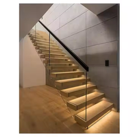 Escalier flottant contemporain en bois massif de noyer américain avec marches en bois et structure de support en acier