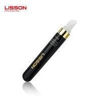 Botella de crema para ojos de masaje de cerámica personalizada Envase cosmético de plástico PE suave vacío Botella de crema para ojos de 15 ml con aplicador de cerámica